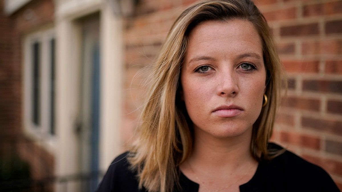 Shannon Keeler poses for a portrait in the United States on Wednesday, April 7, 2021. A series of online messages from a long-ago schoolmate has Keeler, a Gettysburg College graduate, trying again to get authorities to make an arrest in her 2013 sexual assault. (AP Photo)