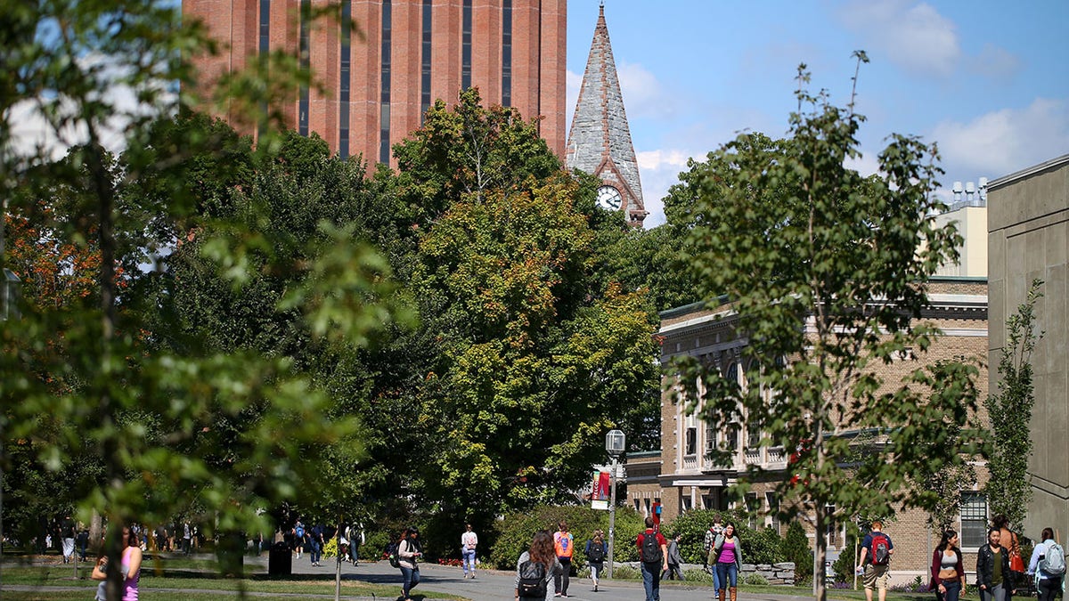 UMass Amherst students walking across campus