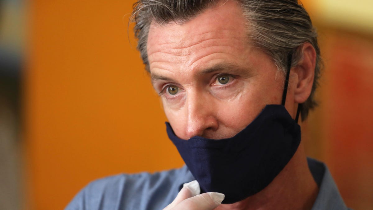 LOS ANGELES, CA - JUNE 03, 2020 - - California Governor Gavin Newsom is interviewed while visiting the Hot and Cool Cafe in Leimert Park after several days of protest in Los Angeles on June 3, 2020. (Genaro Molina / Los Angeles Times via Getty Images)