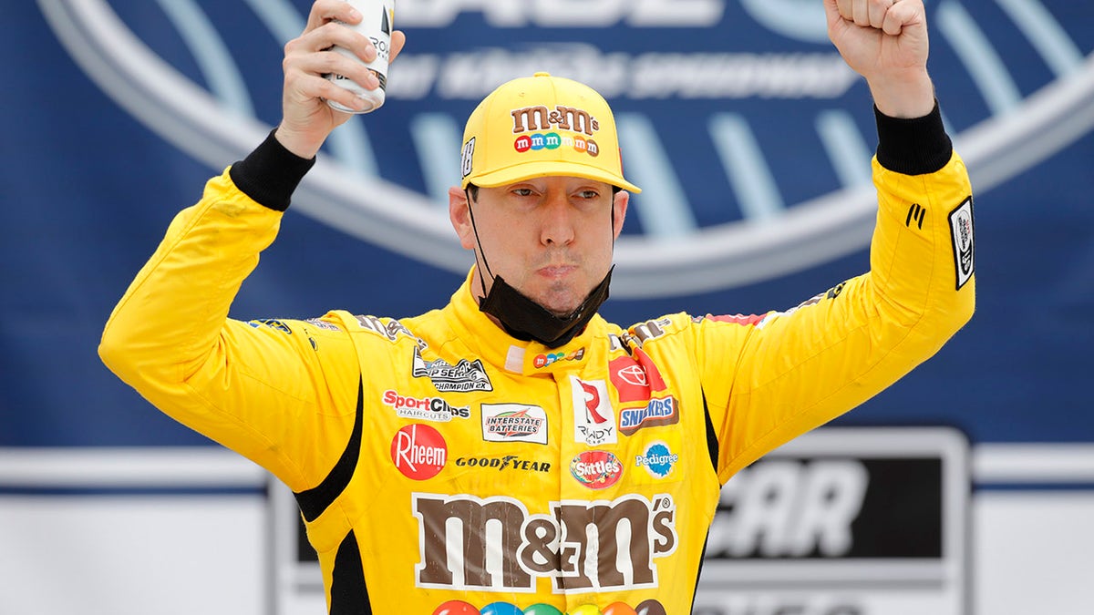 Kyle Busch celebrated in Victory Lane after winning a NASCAR Cup Series auto race at Kansas Speedway.