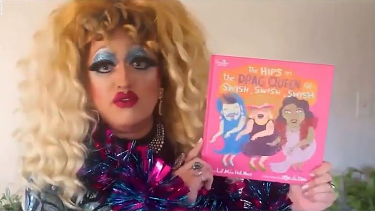 Drag queen with children's book