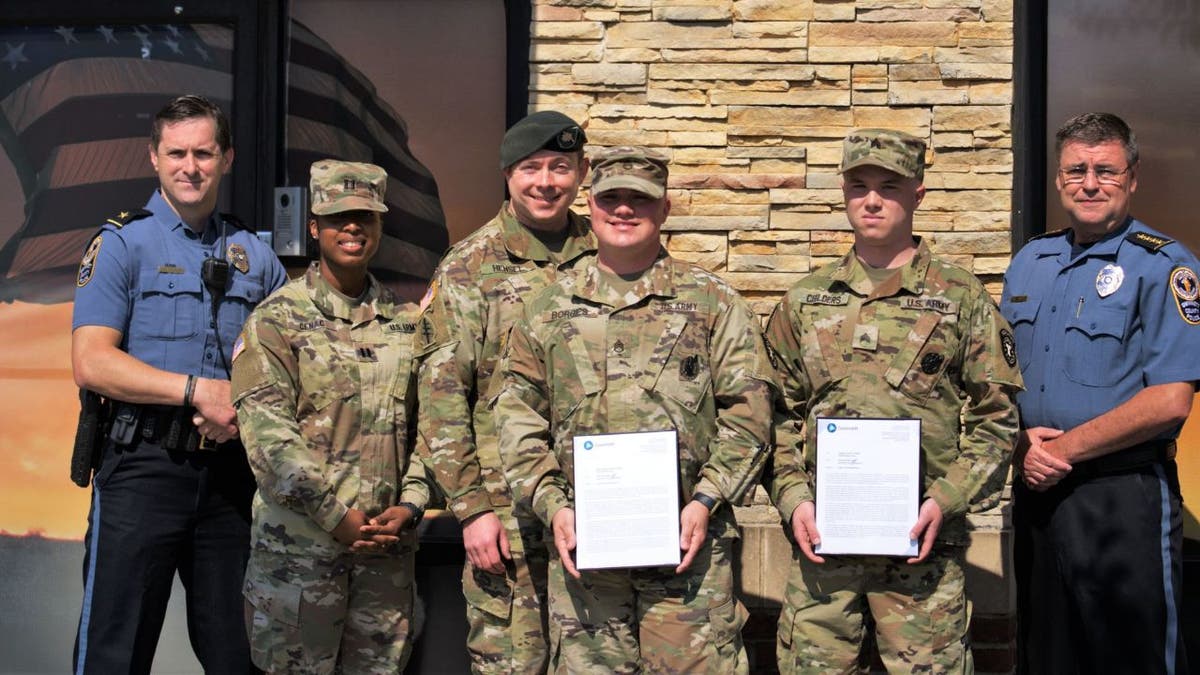 Police in Georgia commended a pair of soldiers who used their combat first aid training to save the life of a man who was shot three times during a road rage incident last month.