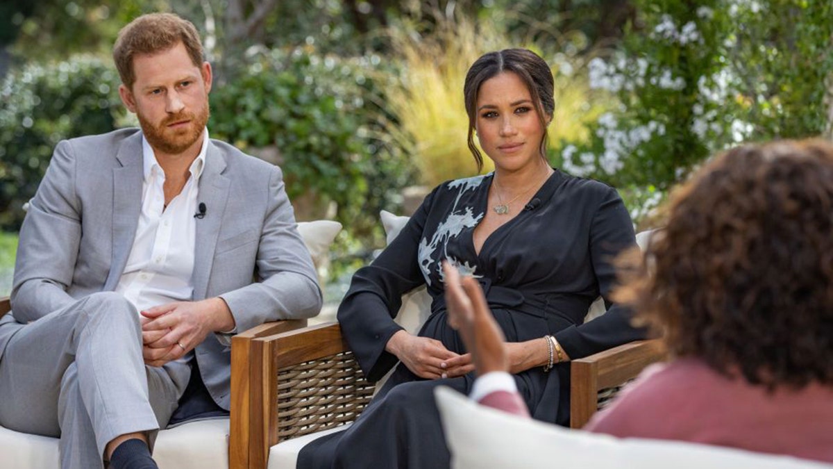 Prince Harry and Meghan Markle being interviewed by Oprah