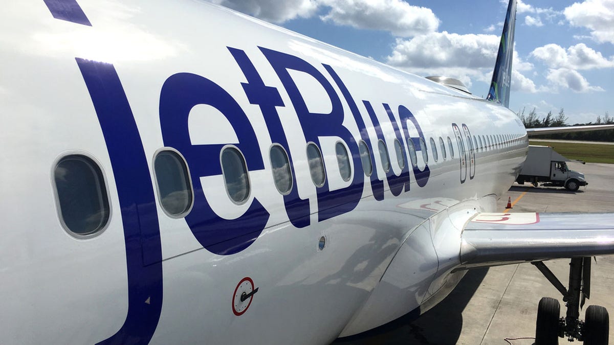 JetBlue land operations and boarding in Owen Roberts Intl. Airport in Grand Cayman Islands