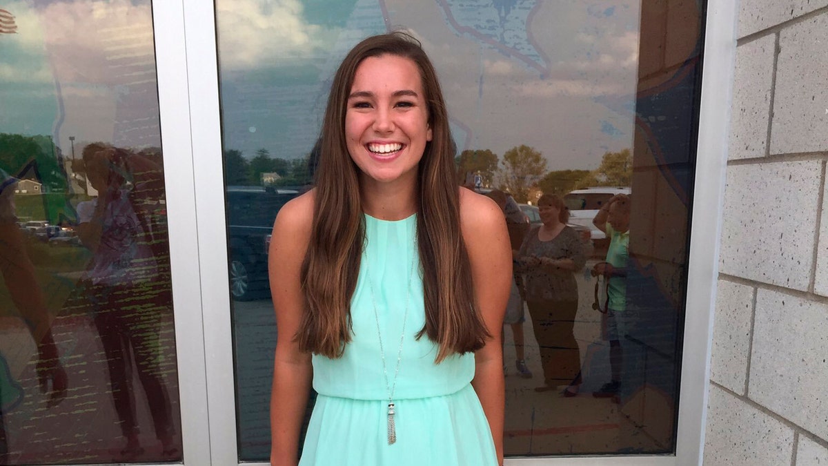 In this September 2016 photo provided by Kim Calderwood, Mollie Tibbetts poses for a picture during homecoming festivities at BGM High School in her hometown of Brooklyn, Iowa. (Kim Calderwood via AP)