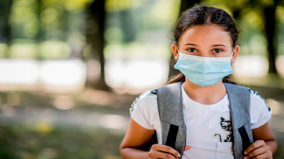 child wearing face mask