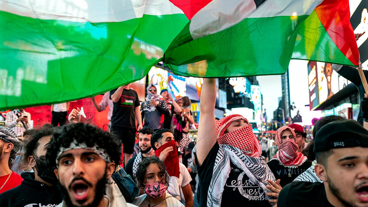 Followers of the Palestinians march in New York on Thursday, May 20, 2021. Israel and Hamas announced a ceasefire that ended a bloody 11-day war that caused a widespread destruction in the Gaza Strip and brought life to a standstill in large parts of Israel. (AP Photo/Craig Ruttle)