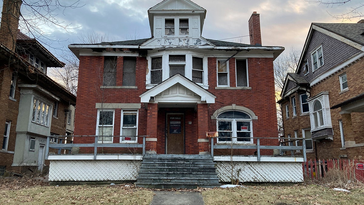 In this March 8, 2021 file photo, a house, in need of repair, sits along East Grand Boulevard, in Detroit. Nicole Curtis, the star of HGTV's "Rehab Addict Rescue," has won a dispute with Detroit over ownership of a blighted home. 