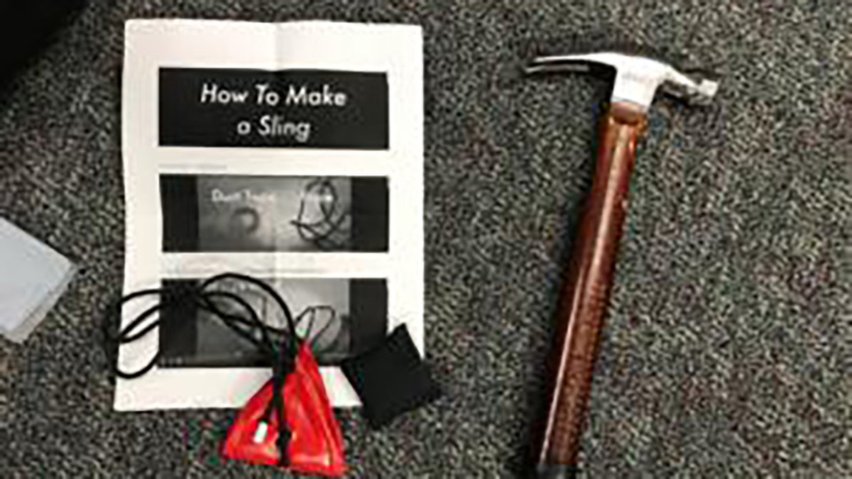 Objects seized from demonstrators included a hammer and instructions on how to make a sling shot. (Portland Police Bureau)