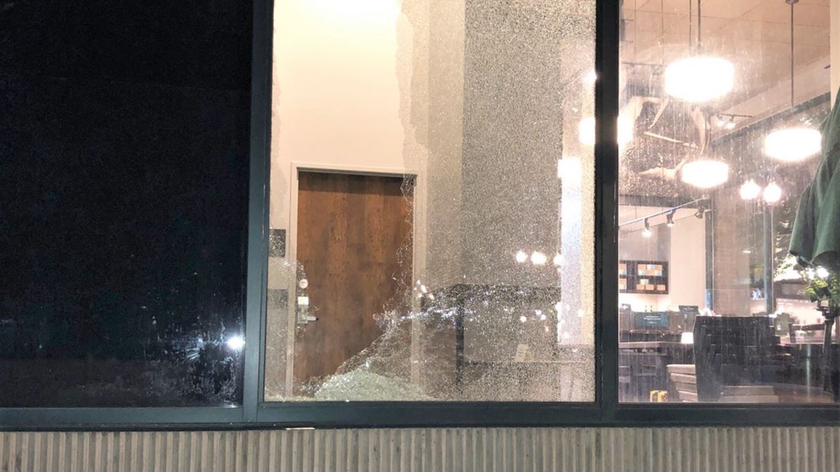 Rioters smashed a Starbucks window in downtown Portland during a night of vandalism earlier this month. 