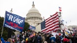 FILE - In this Jan. 6, 2021, file photo, supporters of President Donald Trump besiege the U.S. Capitol in Washington. A 19th person from Ohio has been arrested in Alabama for allegedly convening a caravan of people from Virginia to Washington on Jan. 6 and assaulting police officers during the deadly Capitol riots. (AP Photo/Jose Luis Magana, File)
