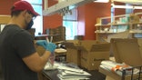 The CDC has paid for the University of Arizona to study the virus and vaccine's impacts on high-risk groups like first responders and front-line workers through the AZ Heroes program. Students are packing up boxes with nasal swabs, test tubes, and return envelopes for the program's participants (Stephanie Bennett/Fox News).