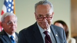 Senate Majority Leader Chuck Schumer of N.Y., walks away following a media availability on Capitol Hill in Washington, Tuesday, May 18, 2021. Sen. Bob Menendez, D-N.J., is at left. (AP Photo/Susan Walsh)