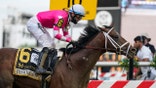 Flavien Prat atop Rombauer reacts as he crosses the finish line to win the Preakness Stakes horse race at Pimlico Race Course, Saturday, May 15, 2021, in Baltimore. (AP Photo/Julio Cortez)