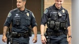 May 26, 2021; Austin, TX, USA; Austin police officers Eddie Pineda, left, and Chandler Carrera arrive at a news conference at the Austin Police Department headquarters on Wednesday May 26, 2021, to speak about their experience of saving a man from a burning truck. (Jay Jannar-USA TODAY NETWORK)
