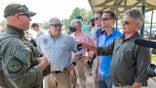 Rep. Michael McCaul (right) speaks to Border Patrol agents at the Rio Grande Valley in Texas.