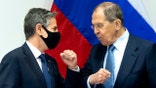 U.S. Secretary of State Antony Blinken, left, greets Russian Foreign Minister Sergey Lavrov, right, as they arrive for a meeting at the Harpa Concert Hall in Reykjavik, Iceland, Wednesday, May 19, 2021, on the sidelines of the Arctic Council Ministerial summit. (Saul Loeb/Pool Photo via AP)