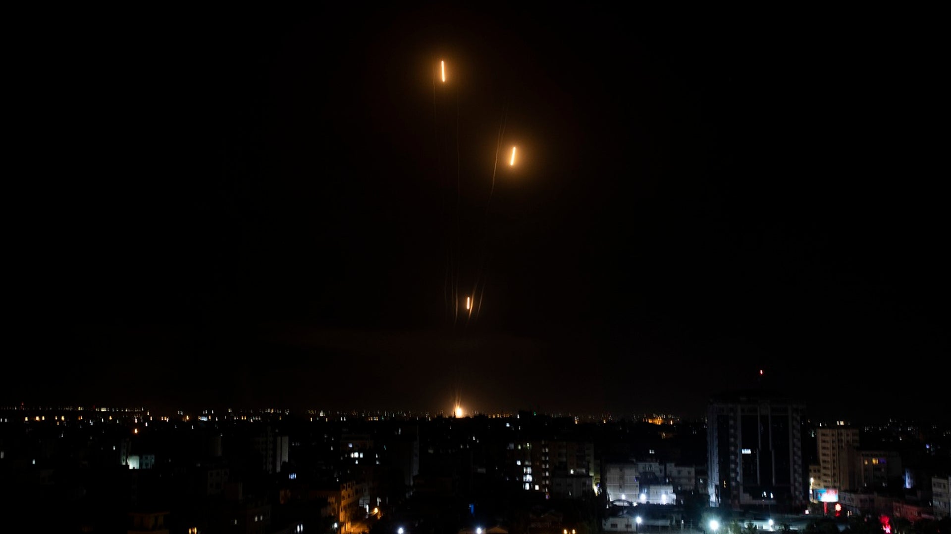 Rockets are launched from the Gaza Strip toward Israel, Tuesday, May. 11, 2021. The barrage of rockets from the Gaza Strip and airstrikes into the territory continued almost nonstop throughout the day in what appeared to be some of the most intense fighting between Israel and Hamas since their 2014 war.(AP Photo/Khalil Hamra)