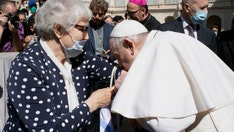 Pope kisses hand of Auschwitz survivor