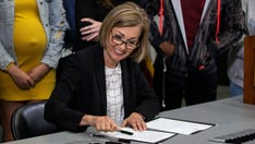 Iowa gov signs bill banning mask mandates in schools