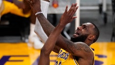 LeBron James hits go-ahead shot, records triple-double in play-in tournament victory over Warriors