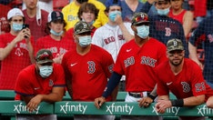 Red Sox fan comes up with flying bat while talking on phone during game