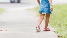 Internet baffled by photo of girl seemingly stuck in sidewalk