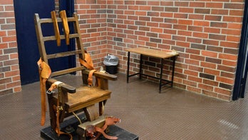 New law makes inmates choose electric chair or firing squad