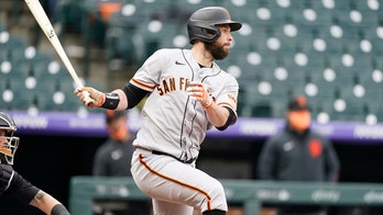 Belt slam in 10-run 1st lifts Giants over Rockies in opener
