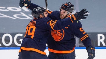 McDavid reaches 100 points, Oilers beat Canucks 4-3