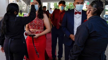 Some proms are back, with masks, testing and distancing