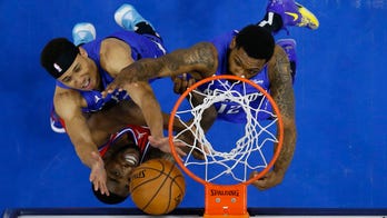 Curry, Embiid help 76ers top Magic, clinch top seed in East