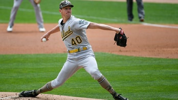 Wild pitch in the 9th lifts Athletics past Twins 7-6