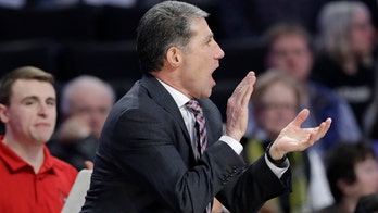 Former Louisville assistant charged by feds with extortion