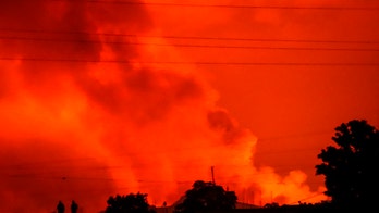 Congo volcano's lava flows short of Goma; 5 dead in crash
