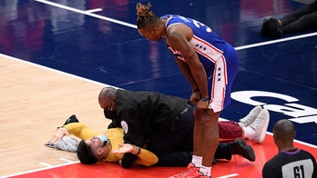 Fans Gone Wild: Spectator tries to get on floor at NBA game