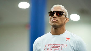 Charles Oliveira wins UFC lightweight title with TKO over Michael Chandler