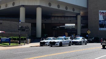 Mississippi officer shot as hunt for armed suspect intensifies