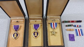 WWII uniform jacket with 2 Purple Hearts returned to daughter of veteran who wore it