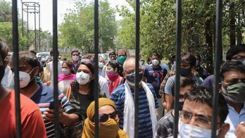 India sees coronavirus surge slowing but experts warn numbers are misleading