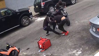 NYC delivery driver's brutal attack by robbers caught on camera, as suspects remain at large month later