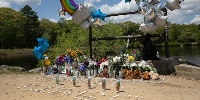 A memorial at Waldo Lake in D.W. Field Park on Monday, May 17, 2021 has grown since Sunday in memory of two Brockton boys who drowned Saturday night. (Alyssa Stone-USA TODAY NETWORK)