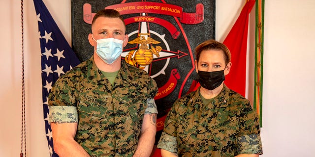 U.S. Marine Corps Staff Sgt. John W. Stefanowicz Jr., (left) with the All-Marine Wrestling Team (AMWT), poses for a photo with Col. Amy R. Ebitz, (right) Commanding Officer of Headquarters and Support Battalion, Marine Corps Installations East-Marine Corps Base Camp Lejeune, on Marine Corps Base Camp Lejeune, North Carolina, April 7, 2021. (U.S. Marine Corps photo by Lance Cpl. Isaiah Gomez)