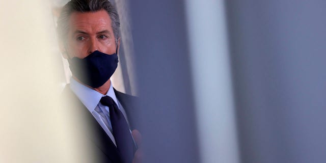 California Governor Gavin Newsom looks on during a press conference at Unity Council on May 10, 2021 in Oakland, California. 