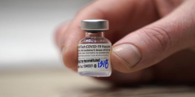 This Jan. 24, 2021, file photo shows a vial of the Pfizer vaccine for COVID-19 in Seattle, Wash.