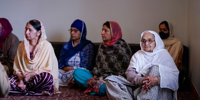 Members of the Sikh Coalition gather at the Sikh Satsang of Indianapolis in Indianapolis, Saturday, April 17, 2021 to formulate the groups response to the shooting at a FedEx facility in Indianapolis that claimed the lives of four members of the Sikh community. A gunman killed eight people and wounded several others before taking his own life in a late-night attack at a FedEx facility near the Indianapolis airport. (AP Photo/Michael Conroy)