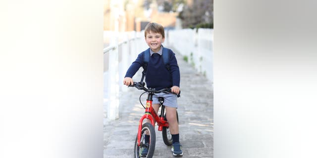 In this handout photo provided by the Duchess of Cambridge, Britain's Prince Louis smiles before his first day of attending Willcocks Nursery School, at Kensington Palace in London, Wednesday, April 21, 2021. Prince Louis turns three years old on Friday April 23. (Duchess of Cambridge via AP)