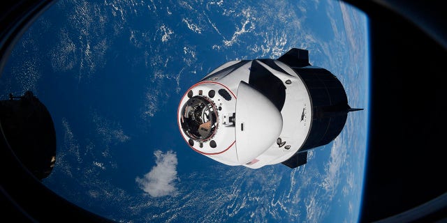 The SpaceX Crew Dragon capsule approaches the International Space Station for docking on April 24, 2021.