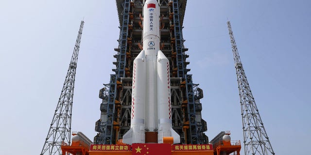 In this photo released by Xinhua News Agency, the core module of China's space station, Tianhe, on the the Long March-5B Y2 rocket is moved to the launching area of the Wenchang Spacecraft Launch Site in southern China's Hainan Province on April 23, 2021. (Guo Wenbin/Xinhua via AP)