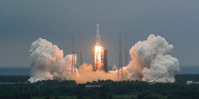 In this photo released by China's Xinhua News Agency, a Long March 5B rocket carrying a module for a Chinese space station lifts off from the Wenchang Spacecraft Launch Site in Wenchang in southern China's Hainan Province, Thursday, April 29, 2021. (Ju Zhenhua/Xinhua via AP)